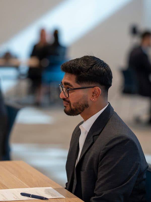 A candidate listening during an interview at Brimstone Sydney 2026